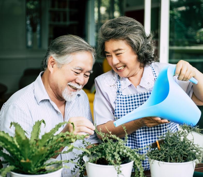 elderly-couples-talking-together-plant-trees-pots.jpg